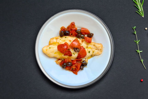 filetto di pesce con olive taggiasche e pomodorini
